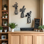 Décoration murale métal silhouette vase noir 37 cm